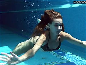 Tiffany Tatum undresses bare underwater